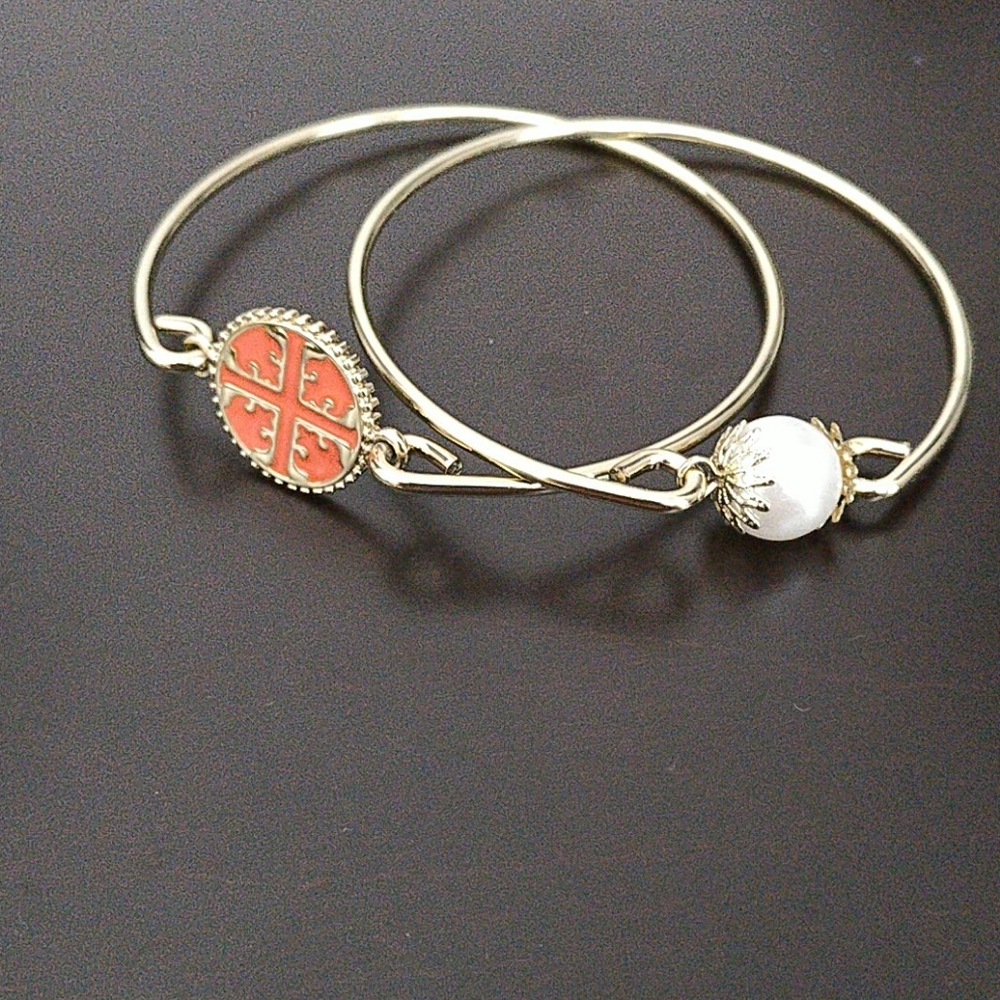 Gold bracelet with orange and pearl embellishments